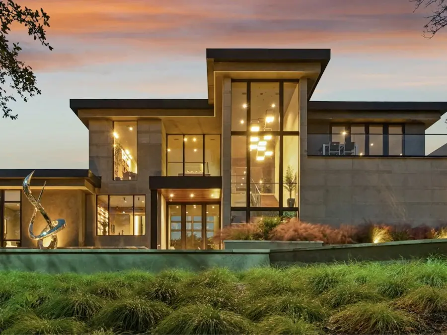 Finished custom home exterior at dusk (placeholder photo)
