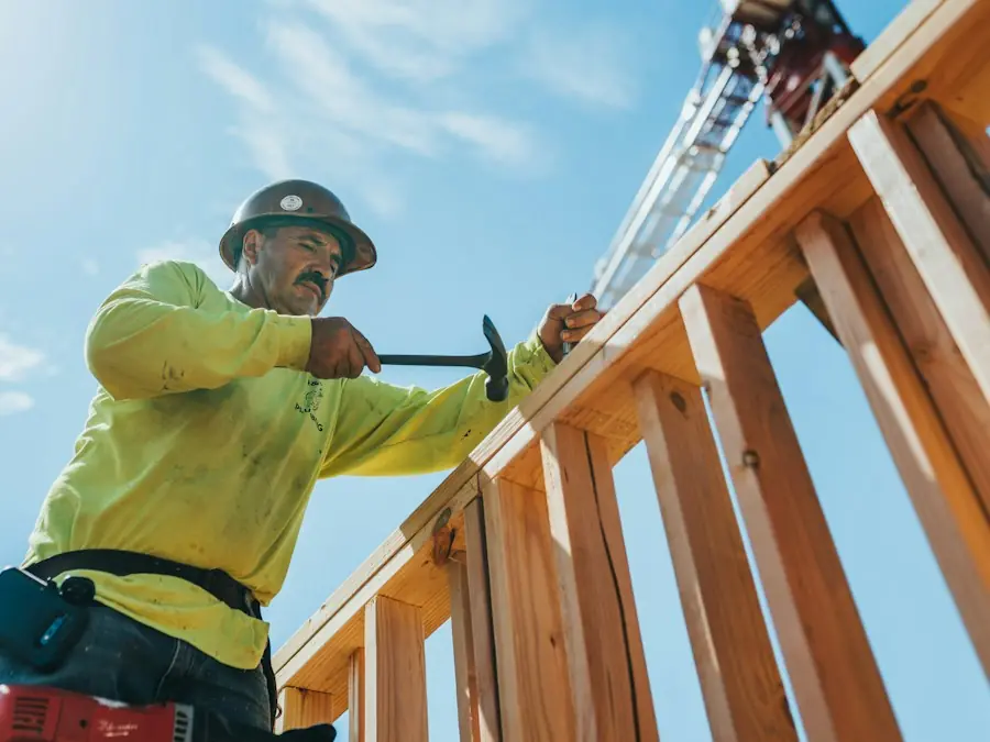 Framer setting wall studs on a new build (placeholder photo)