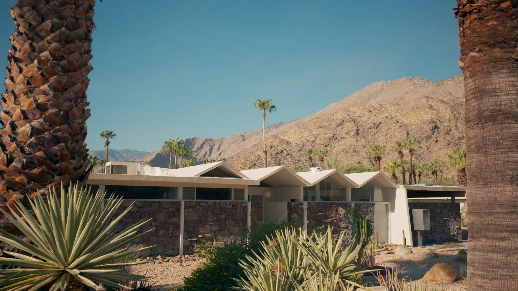 Desert custom home with mountains behind it (placeholder photo)