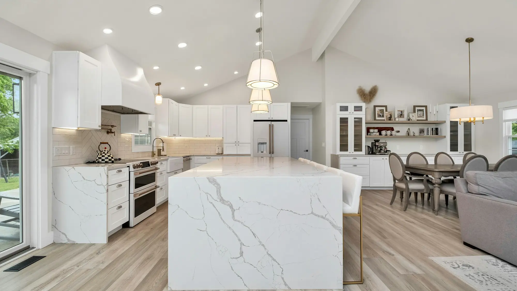 Remodeled kitchen with a marble waterfall island (placeholder photo)