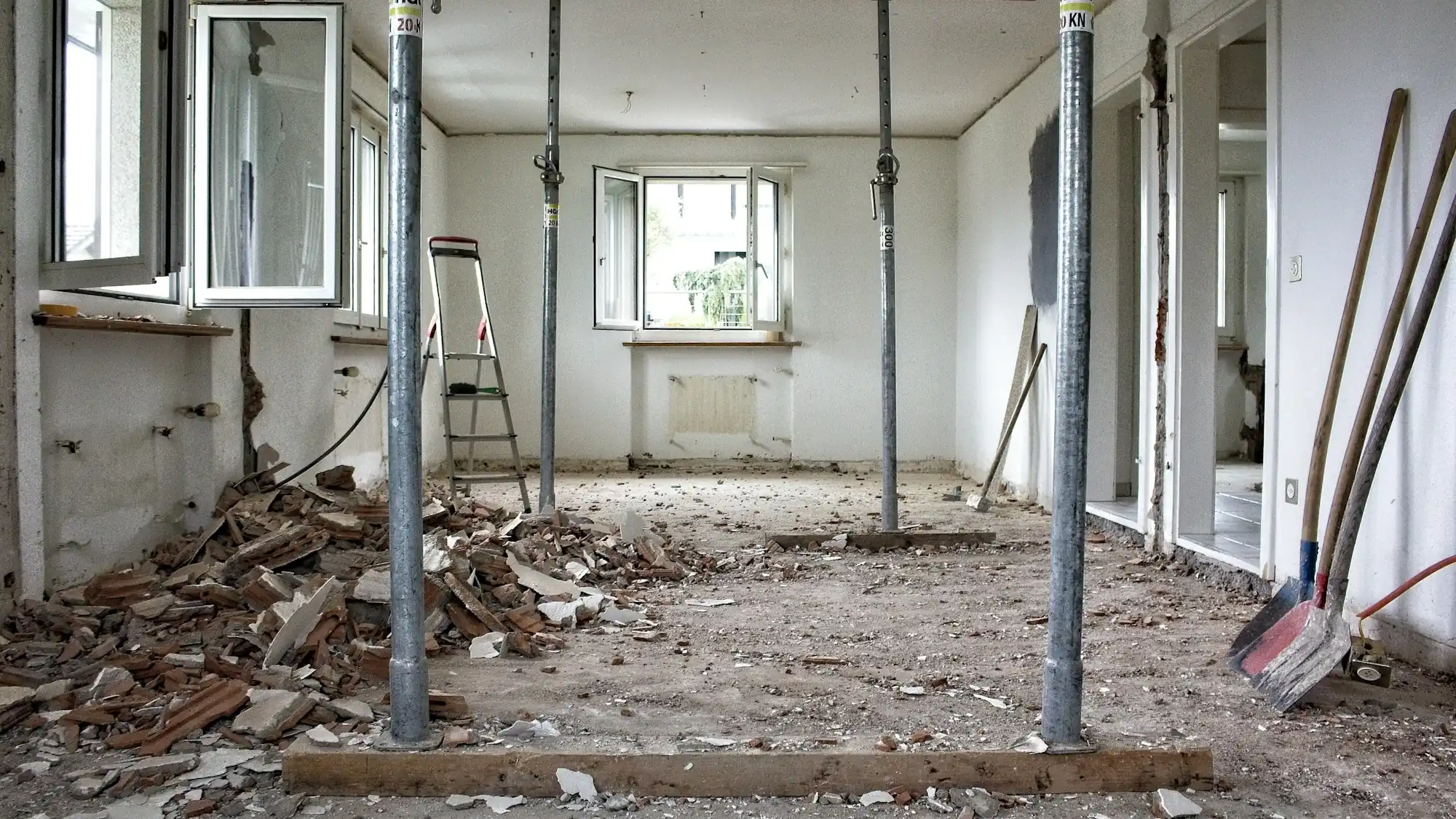 Gutted interior with temporary shoring posts in place (placeholder photo)